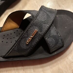 Black Coach flip flops size 6.5 but fit like a 6